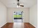 Cozy living room area with wood floors and views to the outside screened in patio at 3038 Elbib, St Cloud, FL 34769