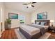 Stylishly furnished main bedroom with a ceiling fan and a large window at 3038 Elbib, St Cloud, FL 34769