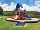 Vibrant community playground featuring slides, climbing structures, and a safe, cushioned surface for active play at 3038 Elbib, St Cloud, FL 34769