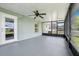 Spacious screened patio with a ceiling fan, offering a comfortable outdoor space at 3038 Elbib, St Cloud, FL 34769