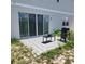Small backyard patio featuring a table and grill at 312 Lake Smart Cir, Winter Haven, FL 33881