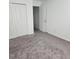 Unfurnished bedroom with neutral carpet and closet at 312 Lake Smart Cir, Winter Haven, FL 33881