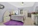 Spacious bedroom with a large window, neutral walls, and stylish furnishings at 3261 Sawgrass Creek Cir, St Cloud, FL 34772