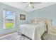 Comfortable bedroom with a window view and carpet flooring at 3261 Sawgrass Creek Cir, St Cloud, FL 34772