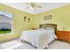 Bright bedroom with a window view and tile flooring at 3261 Sawgrass Creek Cir, St Cloud, FL 34772