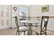 Cozy breakfast nook features a round table, comfortable seating, and a bright window with a view at 3261 Sawgrass Creek Cir, St Cloud, FL 34772