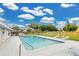 Community pool with lounge chairs offers a refreshing escape and social gathering space at 3261 Sawgrass Creek Cir, St Cloud, FL 34772