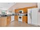 Functional kitchen featuring a range of appliances, ample cabinet space, tile floors and granite countertops at 3261 Sawgrass Creek Cir, St Cloud, FL 34772