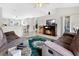 Spacious living room features an open layout, a vaulted ceiling, and a sliding door leading to the backyard at 3261 Sawgrass Creek Cir, St Cloud, FL 34772