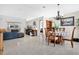 Expansive living room seamlessly connects to the dining area, providing an open and inviting space for entertaining at 3261 Sawgrass Creek Cir, St Cloud, FL 34772