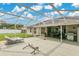 Large screened in patio with outdoor furniture and backyard view at 3261 Sawgrass Creek Cir, St Cloud, FL 34772