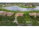 An aerial view showcasing a well-maintained home with an attractive tile roof and landscaping at 3617 Northwoods Dr, Kissimmee, FL 34746