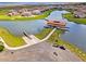 Aerial view of the community boat house with lake access and boat ramp at 3617 Northwoods Dr, Kissimmee, FL 34746