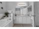 Bright bathroom features a double sink vanity, soaking tub, and separate shower for a spa-like experience at 3617 Northwoods Dr, Kissimmee, FL 34746
