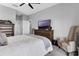 Well-lit bedroom features a ceiling fan, furnishings, and ample space at 3617 Northwoods Dr, Kissimmee, FL 34746