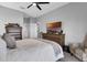 Well-lit bedroom features a ceiling fan, furnishings, and ample space at 3617 Northwoods Dr, Kissimmee, FL 34746