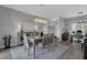 Open dining room with wood floors, a modern chandelier, and views of the adjacent office area at 3617 Northwoods Dr, Kissimmee, FL 34746