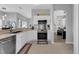 Bright kitchen featuring white cabinets, stainless steel appliances, and an open floor plan at 3617 Northwoods Dr, Kissimmee, FL 34746