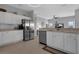 Bright kitchen featuring white cabinets, stainless steel appliances, and tile flooring at 3617 Northwoods Dr, Kissimmee, FL 34746