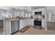 Modern kitchen with white cabinets, stainless steel appliances, and a tile backsplash at 3617 Northwoods Dr, Kissimmee, FL 34746
