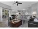 Inviting living area with an open layout to the dining room and sliding glass doors to the patio at 3617 Northwoods Dr, Kissimmee, FL 34746