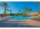 Resort-style community pool with spacious deck, lush landscaping, and inviting lounge areas for residents at 3617 Northwoods Dr, Kissimmee, FL 34746