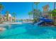 Resort-style pool area featuring a water slide, lush landscaping, and comfortable lounge seating for residents at 3617 Northwoods Dr, Kissimmee, FL 34746