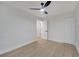 Bedroom featuring neutral walls, a ceiling fan, wood-look floors, and closet storage at 3804 Anthony Ln, Orlando, FL 32822