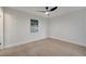 Empty bedroom showcasing wood-look floors, fresh paint, and a view from the window at 3804 Anthony Ln, Orlando, FL 32822