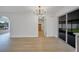 Well-lit dining area with views to the laundry room and outdoor living space at 3804 Anthony Ln, Orlando, FL 32822
