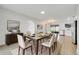 Bright dining room featuring a modern table, chairs, and stylish decor at 3804 Anthony Ln, Orlando, FL 32822