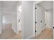 Hallway leading to an updated bathroom with new fixtures and modern design at 3804 Anthony Ln, Orlando, FL 32822