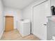 Bright laundry room features a washer and dryer, plus a utility sink for added convenience at 3804 Anthony Ln, Orlando, FL 32822