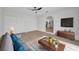 Inviting living room with a comfortable sofa, modern decor, and ample natural light at 3804 Anthony Ln, Orlando, FL 32822