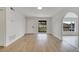 Bright living space with wood-look floors, archway, and a large window that provides natural light at 3804 Anthony Ln, Orlando, FL 32822