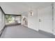 The screened-in patio boasts an outdoor light, with a sliding door to the kitchen at 3804 Anthony Ln, Orlando, FL 32822