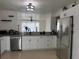 Modern kitchen with stainless steel appliances, granite countertops, and ample cabinet space at 416 Sea Willow Dr, Kissimmee, FL 34743