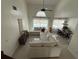 Bright living room with high ceilings, tile flooring, and plenty of natural light overlooking pool at 416 Sea Willow Dr, Kissimmee, FL 34743