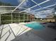 Screened-in pool area with an expansive deck, providing an ideal space for outdoor relaxation at 416 Sea Willow Dr, Kissimmee, FL 34743