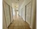 Hallway with tile floors leads into the home, with the view of the backyard through the glass doors at 453 Alston Dr, Orlando, FL 32835