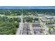 An aerial view of residential area with lush green trees and a waterfront view at 5103 Jones Rd, St Cloud, FL 34771