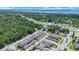 An aerial view of a townhome community near a lake with easy access to major roadways at 5103 Jones Rd, St Cloud, FL 34771