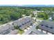 A birds-eye view of a residential area, showcasing a mix of townhomes and green spaces at 5103 Jones Rd, St Cloud, FL 34771