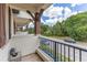 Balcony view featuring sturdy posts, metal railings, and a street view at 5103 Jones Rd, St Cloud, FL 34771