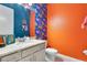 Bathroom with a vanity with granite countertop, and bright accent walls at 5103 Jones Rd, St Cloud, FL 34771
