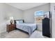 Cozy bedroom features a plush bed, natural light, and modern furnishings at 5103 Jones Rd, St Cloud, FL 34771