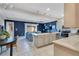 Open kitchen featuring stainless steel appliances, a center island, and a view to the living area at 5103 Jones Rd, St Cloud, FL 34771