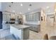 Well-lit kitchen featuring modern appliances, granite countertops, and a breakfast bar at 5103 Jones Rd, St Cloud, FL 34771