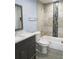 Bright bathroom with new vanity and tiled tub surround at 5144 Picadilly Circus Ct # 2, Orlando, FL 32839