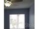 Bedroom featuring natural light with a large window and ceiling fan at 5144 Picadilly Circus Ct # 2, Orlando, FL 32839